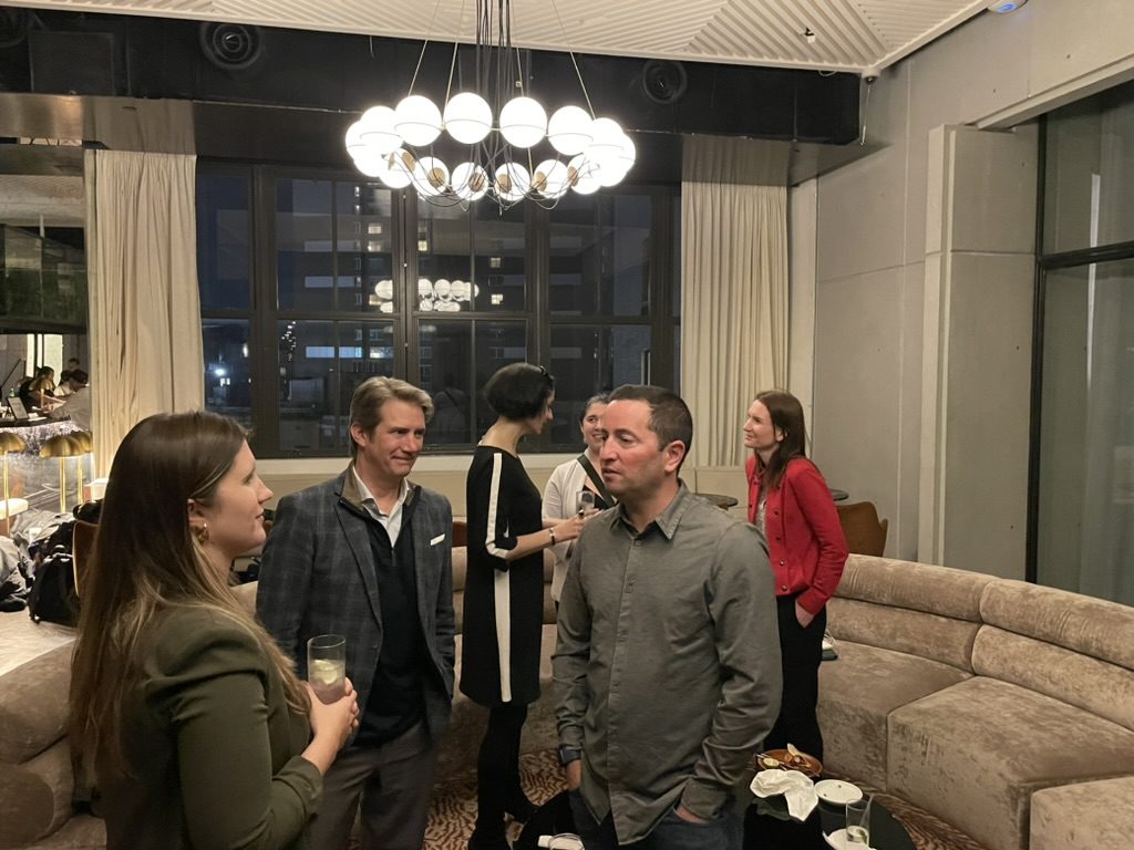 Members at an evening reception in a modern lounge