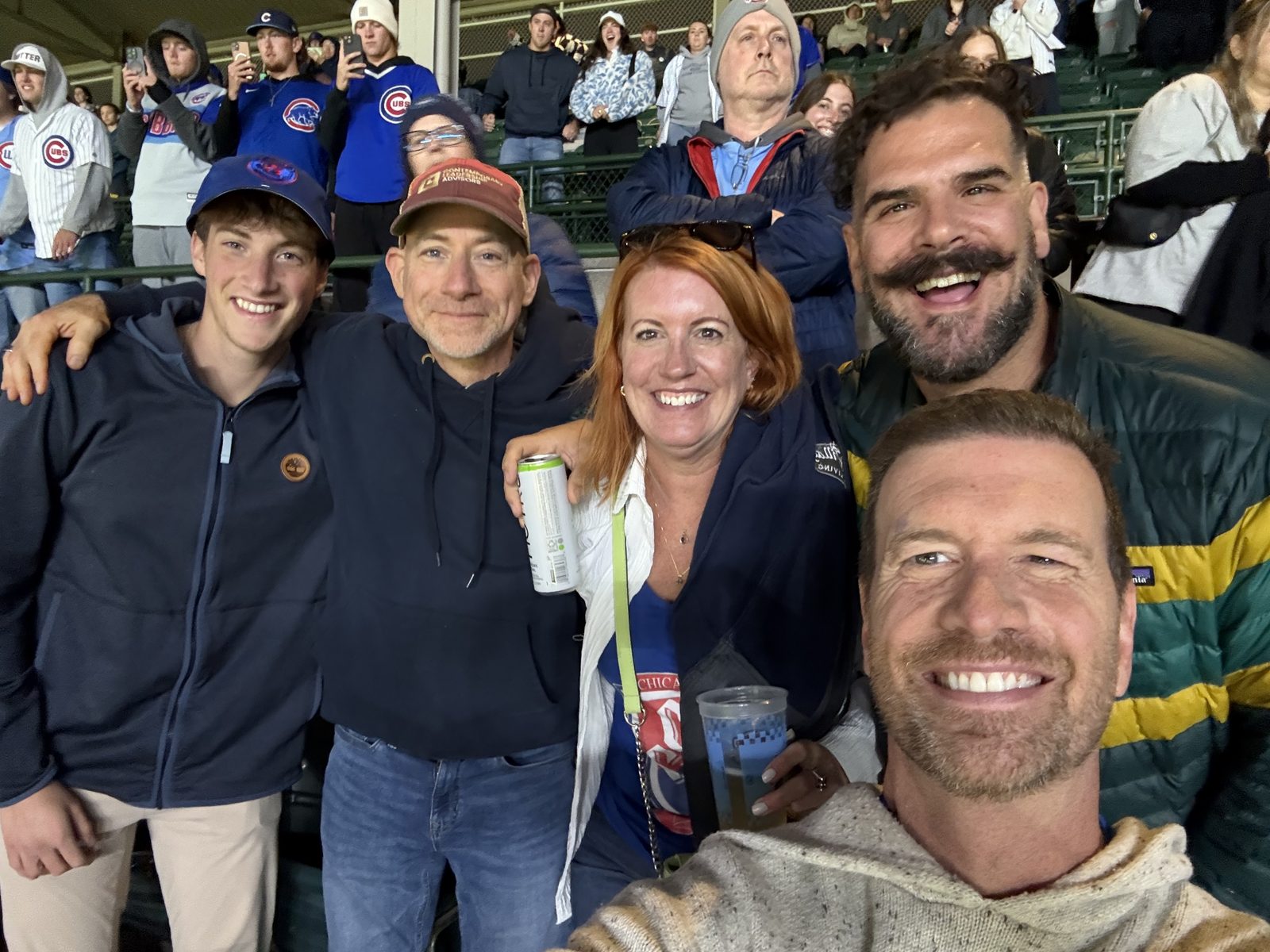 Members enjoying a Cubs game in the stands