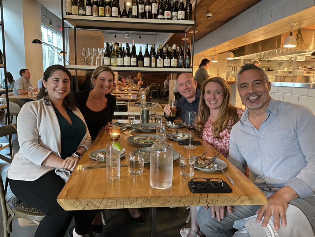 Members at a wine bar dinner in Austin, Texas